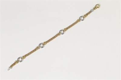 Lot 328 - A 9 carat two colour gold bracelet, of white hoop links spaced by length of yellow curb links,...