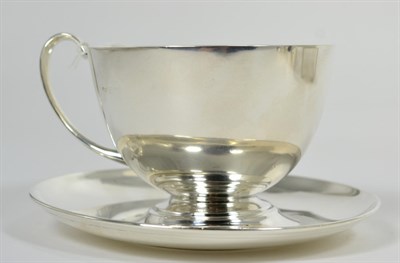 Lot 346 - A George V silver cup and saucer, Birmingham, 1915, 12cm diameter (2)