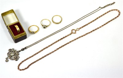 Lot 359 - An 18 carat gold ring; three rings; a chain; and a pendant