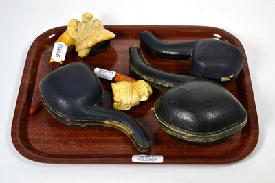 Lot 361 - A small collection of Meerschaum pipes, three cased, including figural designs (5)