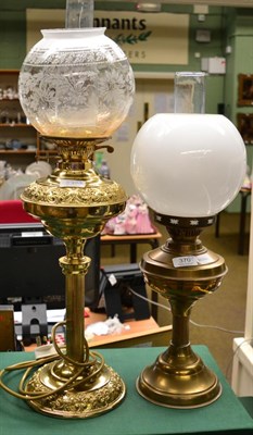 Lot 370 - Two brass oil lamps with glass chimneys and shades