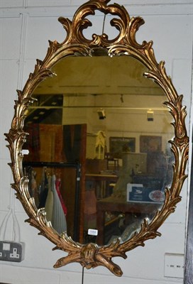 Lot 1084 - An 18th century style gilt oval mirror