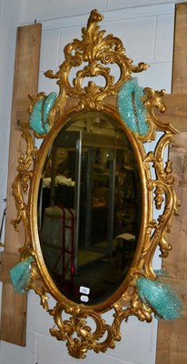 Lot 1089 - An 18th century style gilt oval mirror