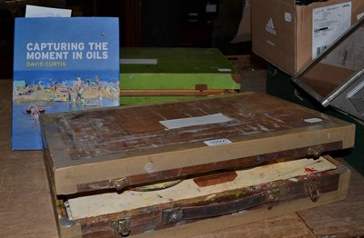 Lot 1092 - Two wooden cases containing artist painting pallet; artist paints and brushes; together with a book