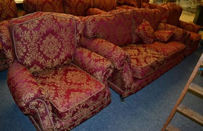 Lot 1141 - A Kirkdale red and gold upholstered three piece suite comprising a pair of armchairs and a...