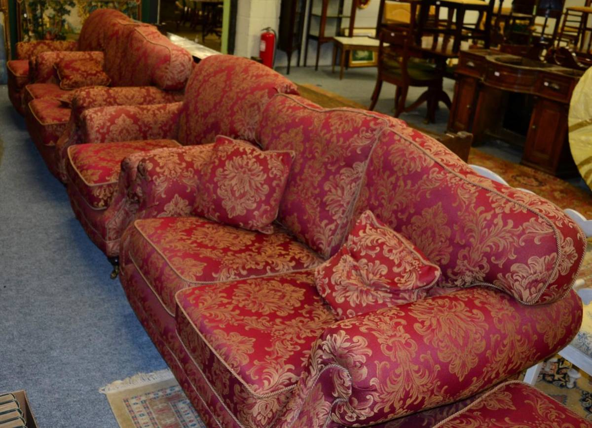 Lot 1142 - A Kirkdale red and gold upholstered five piece suite comprising a pair of two seater sofas, a...
