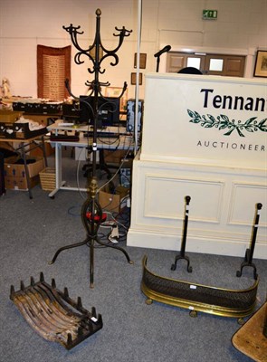 Lot 1143 - A metal coat and hat stand; together with a fire grate; andirons and a Victorian fender