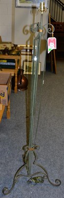 Lot 1157 - A wrought iron standard lamp with shade