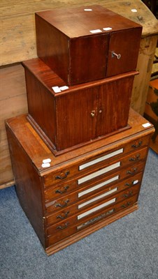 Lot 1163 - Two mahogany coin cabinets and an early 20th century cigarette shop cabinet (3)