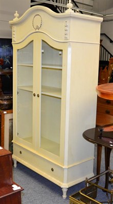 Lot 1168 - A cream painted cupboard