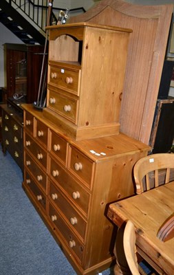 Lot 1178 - A pine chest of drawers and matching bedside cabinet