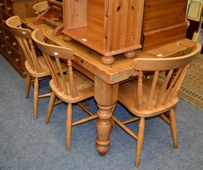 Lot 1180 - A pine table and a set of six chairs