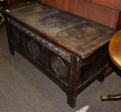 Lot 1194 - A 18th century carved oak three panel coffer