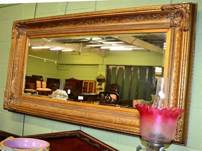 Lot 1195 - A rectangular gilt framed overmantel mirror