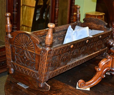 Lot 1212 - An early 19th century carved oak crib