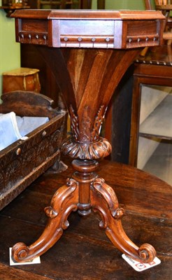 Lot 1213 - A Victorian rosewood sewing table, with octagonal hinged top on carved support and cabriole...