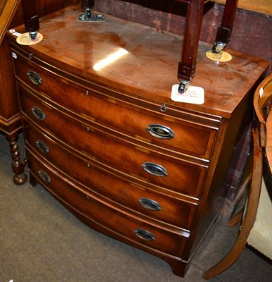 Lot 1219 - A reproduction bow fronted four height chest of drawers