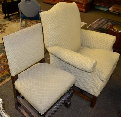 Lot 1242 - An oak framed armchair and an oak framed dining chair