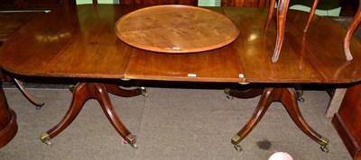 Lot 1254 - A mahogany twin pedestal dining table on outswept cabriole supports, stamped 6185 to underside