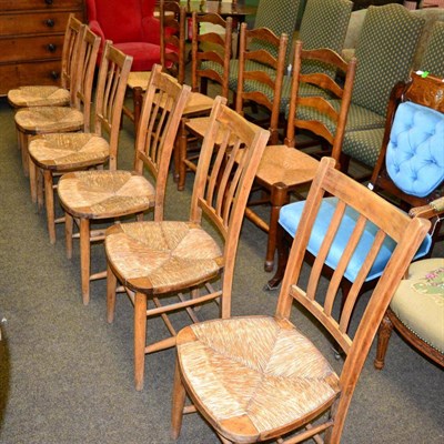 Lot 1260 - A set of six rush seated chairs and a set of four elm rush seated ladder back chairs