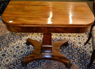 Lot 1266 - An early 19th century mahogany fold over tea table