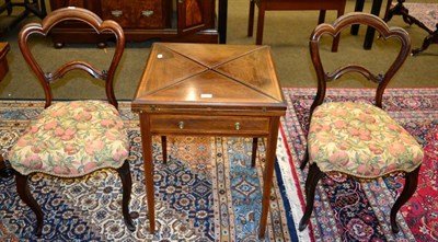 Lot 1267 - A rosewood envelope table and a pair of chairs (3)