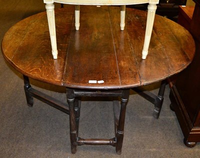 Lot 1275 - An 18th century oak gateleg table