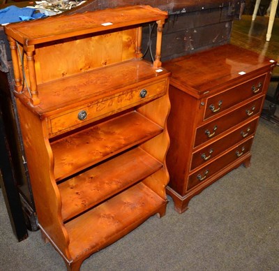 Lot 1276 - A reproduction yew wood batchelor's chest of drawers and a reproduction yew wood waterfall bookcase