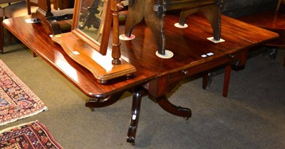 Lot 1300 - An early 19th century mahogany drop leaf table, single drawer with hinged leather insert, raised on