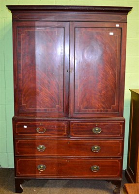 Lot 1306 - A 19th century inlaid mahogany linen press fitted with five dressing slides