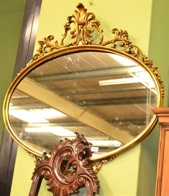 Lot 1309 - A reproduction gilt mirror