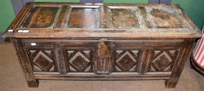 Lot 1313 - An 18th century oak panelled coffer, carved geometric design