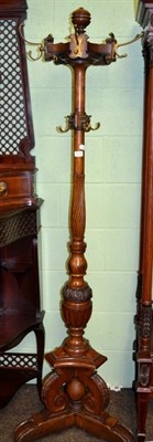 Lot 1318 - An oak hall stand with revolving coat rack