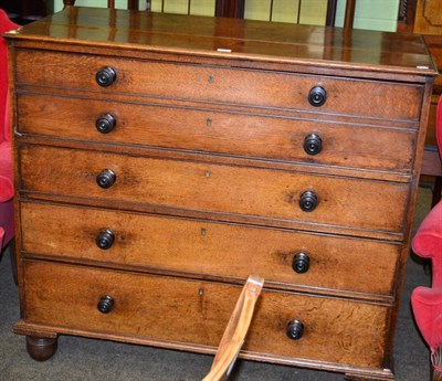 Lot 1322 - An early 19th century oak secretaire chest of drawers