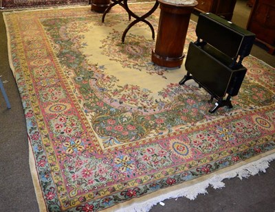 Lot 1337 - Kirman design carpet, the cream field with central medallion enclosed by coral pink borders,...