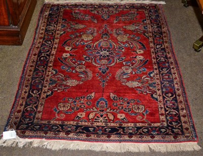 Lot 1339 - Saroukh rug, West Iran, the madder floral field enclosed by meandering vine borders, 145cm by 100cm