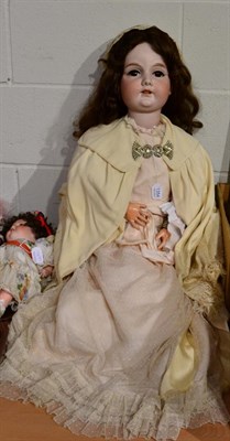 Lot 1354 - A large Armand Marseille bisque socket head doll, with sleeping brown eyes, open mouth,...