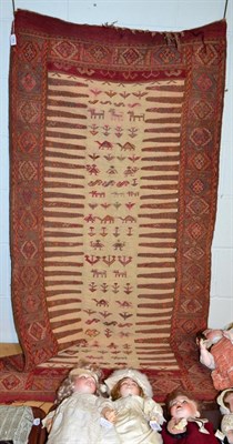 Lot 1362 - Eastern rug with cream striped centre panel woven with figures, 180cm by 90cm