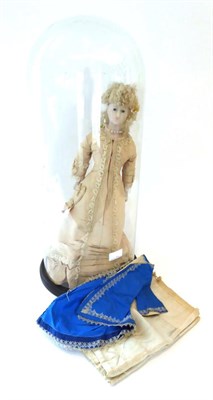 Lot 1371 - A Victorian wax shoulder head doll, with oval blue glass eyes, pierced ears hung with earrings,...