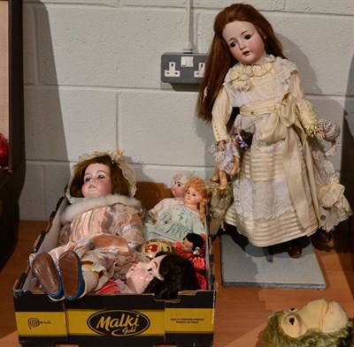 Lot 1375 - A large German Revalo doll, fully clothed in cream silk and lace dress, parasol, holding...