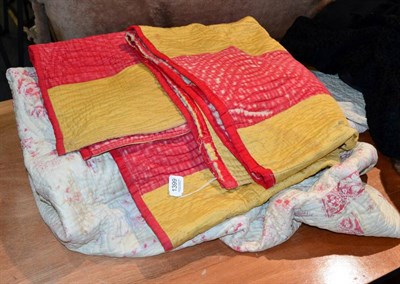 Lot 1399 - A cream and red reversible quilt with a mustard yellow trim and a turkey red and yellow striped...