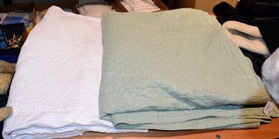 Lot 1401 - Late 19th century white quilt, 180cm by 245cm; and a green quilt, 218cm by 222cm (2)...