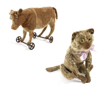 Lot 1410 - Circa 1910 Steiff mohair jointed cat, with stitched paws and mouth, 35cm long; together with a...