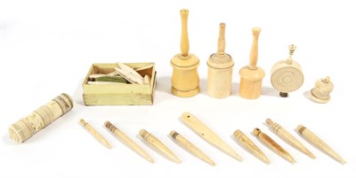 Lot 1433 - Assorted ivory, bone and ivorine spools, bodkins and four powder shakers including two ivory...