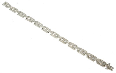 Lot 56 - A 9 carat white gold diamond bracelet, formed of pavé set H-shaped and double bar links, total...
