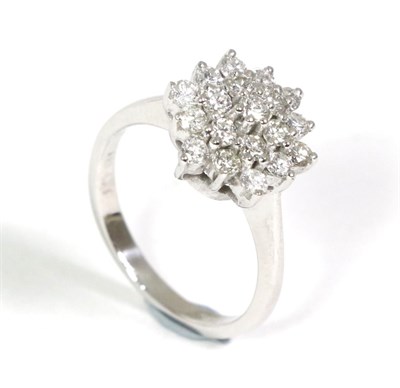 Lot 62 - A diamond cluster ring, of three tiers of round brilliant cut diamonds in claw settings, to...