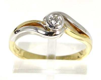 Lot 67 - An 18 carat two colour gold solitaire diamond ring, a round brilliant cut diamond in a rubbed...