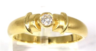 Lot 69 - An 18 carat gold solitaire diamond ring, a round brilliant cut diamond in a rubbed over setting, to