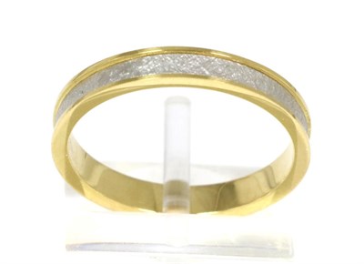 Lot 86 - An 18 carat gold and platinum band ring, a recessed textured polished platinum band between...
