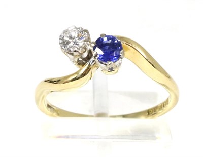 Lot 89 - An 18 carat gold sapphire and diamond two stone ring, a round cut sapphire and a round...